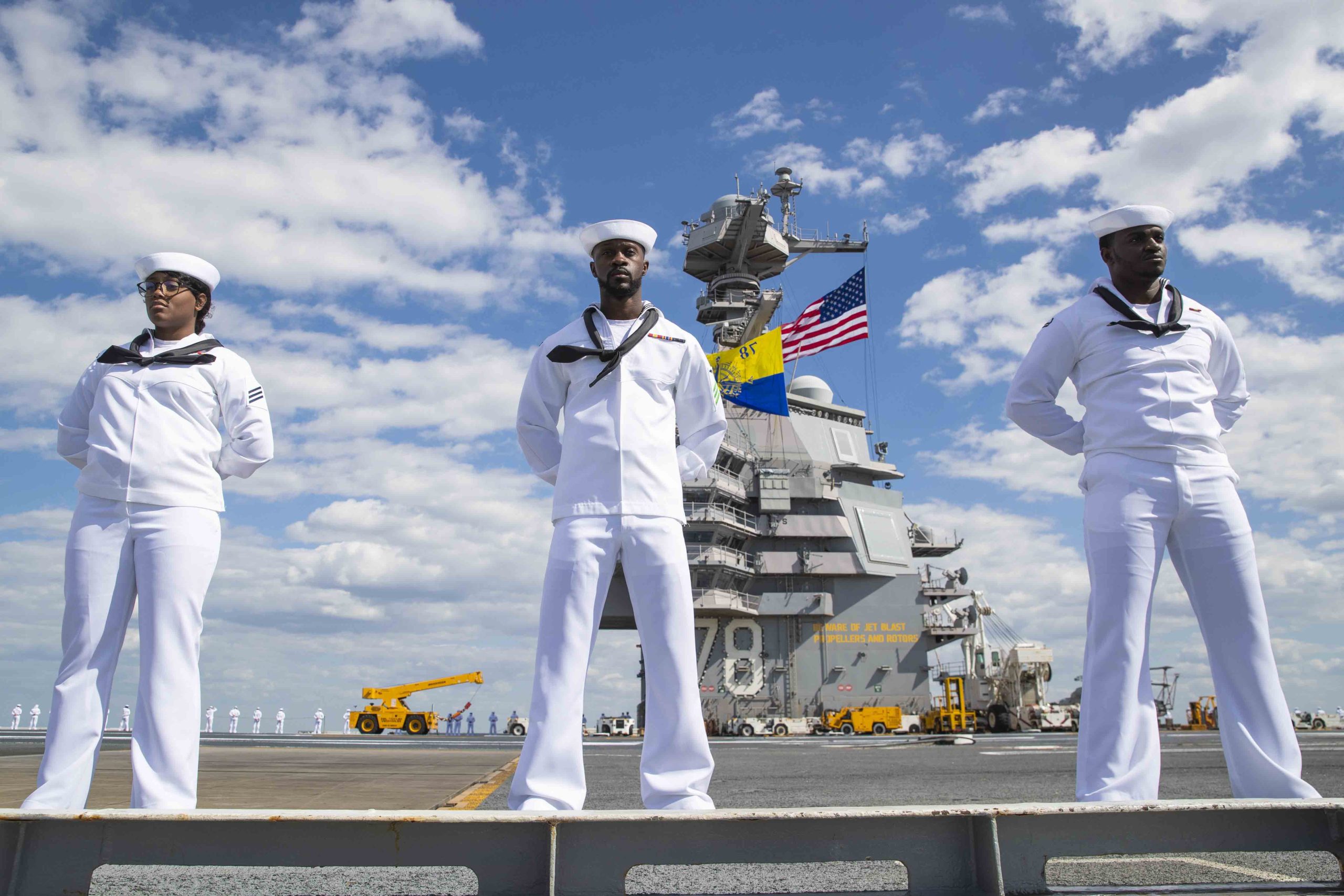 Sailors assigned to the first-in-class aircraft carrier USS Gerald R. Ford (CVN 78) man the rail on the flight deck, May 2, 2023. Gerald R. Ford is the flagship of the Gerald R. Ford Carrier Strike Group. As the first-in-class ship of Ford-class aircraft carriers, CVN 78 represents a generational leap in the U.S. NavyÕs capacity to project power on a global scale. (U.S. Navy photo by Mass Communication Specialist 2nd Class Nolan Pennington)